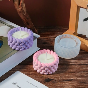 Macro detail of cylindrical silicone candle mold with fine woven texture and finished crafts