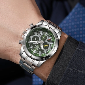 Close-up of business men's quartz watch with green dial and silver steel band on wrist