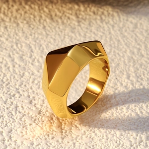 Minimalist gold stainless steel geometric ring with irregular facets in a glossy finish