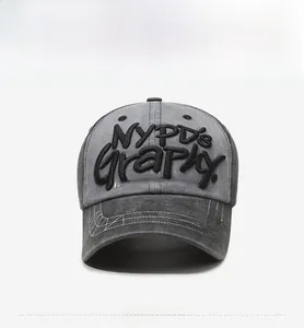 Detail of vintage gray baseball cap with NYPD's Graphy 3D embroidery and contrast stitching