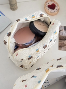 Close-up of quilted makeup bag with cute bear print and large storage capacity
