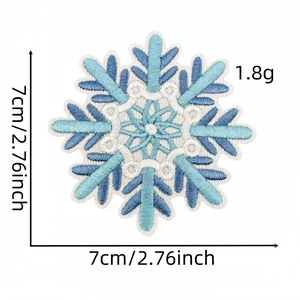 Detailed embroidery of a 7cm blue snowflake iron-on patch for clothing and hats