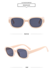 Detail view of oval beige sunglasses with black lenses showing front and side perspectives