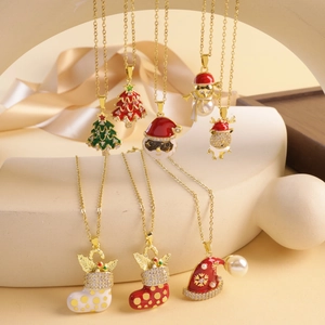 Golden Christmas necklace collection featuring festive tree and reindeer charms