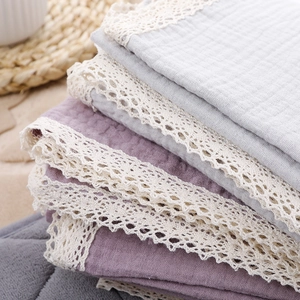 Soft cotton muslin baby blanket with white crochet lace trim in light purple and grey blue