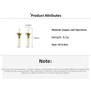 Detail of butterfly tassel earrings showing 7.9x2.4cm dimensions and enamel finish