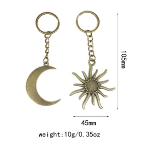 Detail view of retro sun and moon keychains with 105mm length and 45mm width specs