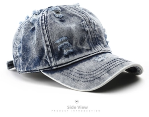 Vista laterale della detagliata di berretto da baseball in denim blu con fori stile vintage