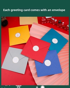 Macro view of colorful square envelopes with Lucky Best Wishes gold seals and red background