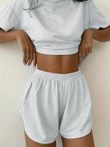 Detailed close-up of grey and white striped knit loungewear set featuring elastic waistband