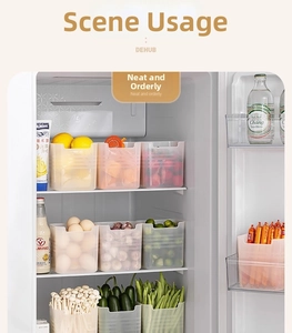 Detail view of transparent fridge organizers holding groceries and sauces on side door shelves