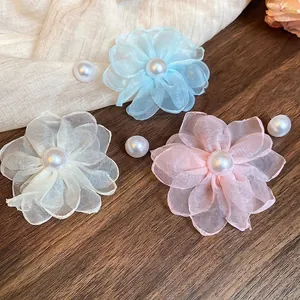 Elegant asymmetric chiffon flower earrings with pearls in blue, white, and pink tones