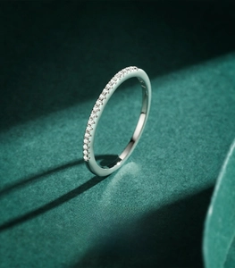 Macro detail of S925 sterling silver band ring with sparkling crystal line decoration