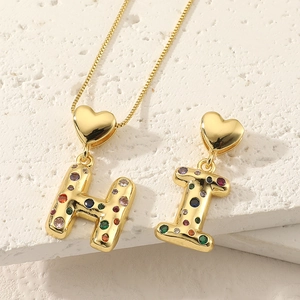 Golden heart-shaped necklace pendant with 26 letters and colorful cubic zirconia inlay