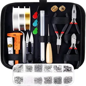 Macro shot of a professional jewelry DIY tool kit with pliers and beads in a black bag