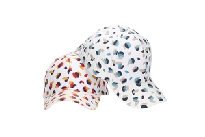 Detailed view of colorful leopard print baseball caps with vibrant abstract patterns