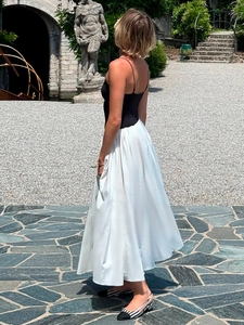 High waist pleated white maxi skirt with flowy silhouette for resort vacation style