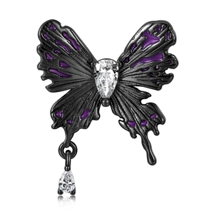 Detailed macro of black butterfly pendant with purple enamel and zircon teardrop