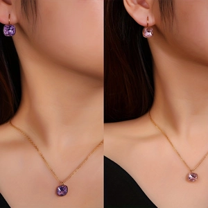 Detail view of square zircon jewelry set with purple and pink pendants on gold chains