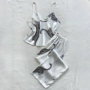 Women's leopard print satin pajama set with V-neck camisole and long pants in cream white