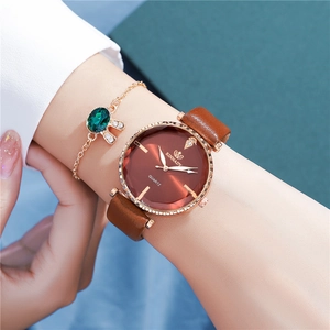 Elegant rose gold women's quartz watch with brown leather strap and matching bracelet