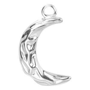 Detailed view of silver crescent moon pendant with hammered texture and polished finish