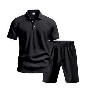 Detail of black men's polo and shorts set with waffle texture and drawstring waist