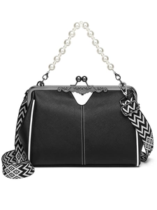 Detail of vintage black crossbody bag with pearl handle and geometric patterned strap