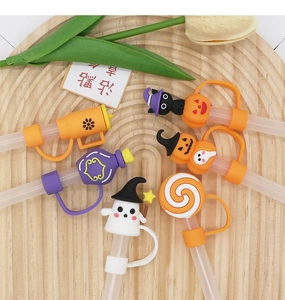 Detailed view of Halloween themed 10mm silicone straw covers featuring pumpkin and ghost shapes