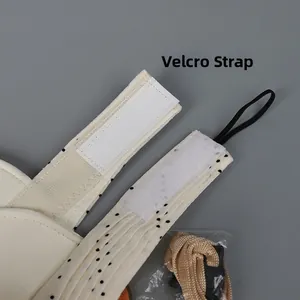 Detail of adjustable velcro strap and elastic cord on a beige polka dot sun hat