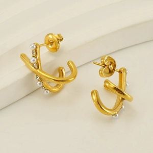 Elegant gold hoop earrings with pearls and crystals in a modern double ring design