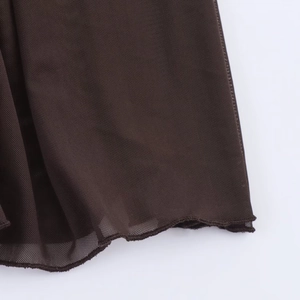 Detailed close-up showing the mesh fabric texture and high-quality hem stitching on the brown dress