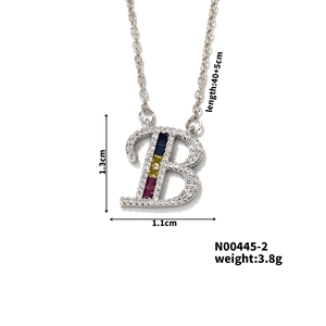 Detailed view of silver letter B pendant with colorful stones and 1.3cm height measurement