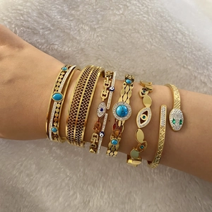 Gold stainless steel bracelet set with evil eye, snake motif, and turquoise stone