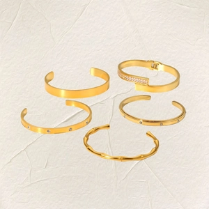 Set of five 18K gold plated stainless steel bracelets with zircons and bamboo texture