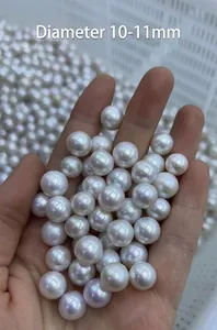 Macro shot of large 10-11mm natural white pearls with high luster and smooth surface