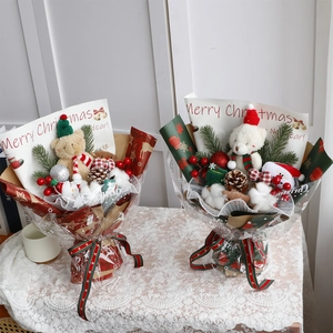 Christmas bear plush bouquet with pine cones and festive ornaments in gift wrapping