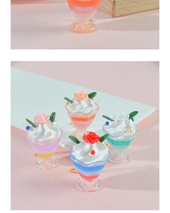 Detailed view of artificial ice cream sundae charms with cream and rose ornaments