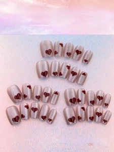 Detail view of 30pcs cat eye press-on nails set with red hearts in M, S, XS sizes