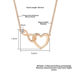 Macro shot of rose gold heart and infinity pendant set with dimensions 1.6x2.6cm