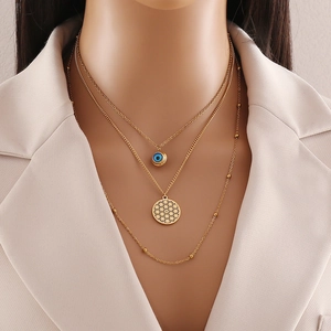 Three-layer gold stainless steel necklace featuring blue evil eye and flower of life pendants