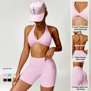 Pink cross-front sports bra and high-waist shorts set in high-stretch fabric for gym workout