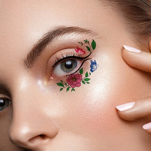 Detailed view of floral and butterfly face gems makeup stickers for music festivals