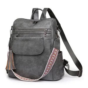 Grey vintage PU leather backpack for women with colorful woven strap and tassel