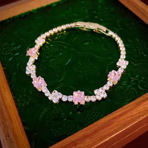 Elegant gold bracelet featuring five pink square stones with micro-pave zircon details