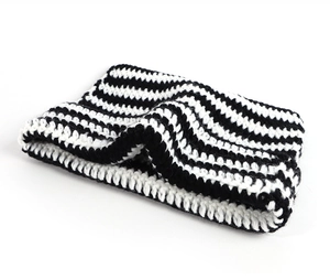 Close-up of the black and white horizontal striped knit texture and fabric detail