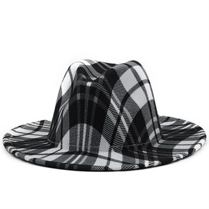 Close-up of black and white plaid wool felt fedora showing high-quality woven texture