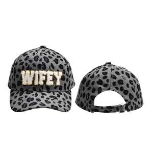 Close-up of grey leopard print corduroy cap with WIFEY sequin patch and metal buckle