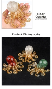 Macro shot of octopus figurine with clear quartz crystals and gold flakes decoration