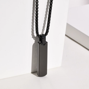 Minimalist black rectangular stainless steel pendant necklace with geometric shadow detail